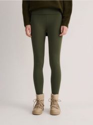 Legginsy z wysokim stanem - ciemnozielony. Zielone legginsy damskie Reserved, bez wzorów, z dzianiny. W wyprzedaży za 39.99 zł.