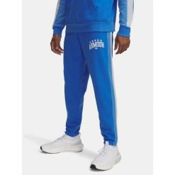 Spodnie Męskie Under Armour Dresowe Z Logo Rival Fleece Colorblock. Niebieskie spodnie sportowe męskie Under Armour, m, bez wzorów, z dresówki, na fitness i siłownię. Za 139.99 zł.