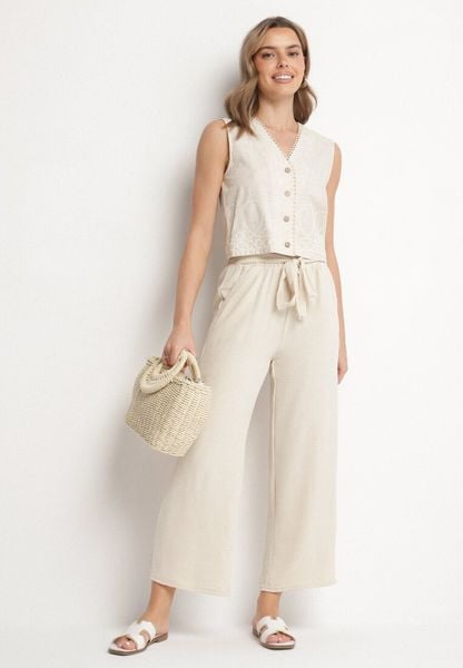 Beżowe Szerokie Spodnie z Wiskozą i Wysokim Stanem Ozdobione Wiązaniem Selwia. Brązowe spodnie materiałowe damskie Born2be, bez wzorów, z jeansu, klasyczne, z podwyższonym stanem. Za 49.99 zł.