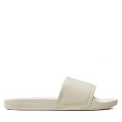 Klapki Calvin Klein Jeans. Białe klapki damskie Calvin Klein Jeans, bez wzorów, z jeansu, bez obcasa, bez zapięcia. Za 219.99 zł.
