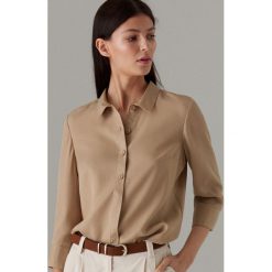 Koszula w stylu safari z lyocellu - Beżowy. Brązowe koszule damskie Mohito, bez wzorów, z lyocellu, bez kołnierzyka, bez ramiączek. Za 119.99 zł.