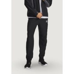 Spodnie Mężczyzna UNDER ARMOUR UA TECH SPORT PANT. Czarne spodnie sportowe męskie Under Armour, m, bez wzorów, na fitness i siłownię. Za 336.30 zł.