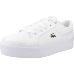 Tenisówki Lacoste Model Ziane Kolor Biały. Białe trampki i tenisówki damskie Lacoste, bez wzorów, z materiału, bez zapięcia. Za 369.80 zł.