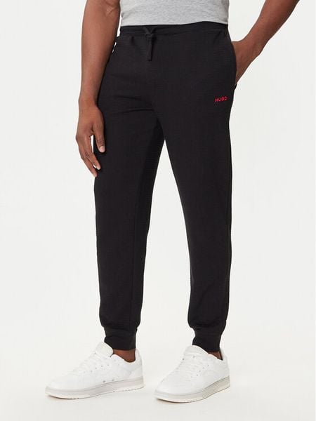 HUGO Spodnie dresowe Austin 50532012 Czarny Regular Fit. Czarne spodnie sportowe męskie Hugo, m, bez wzorów, z dresówki. Za 189.99 zł.