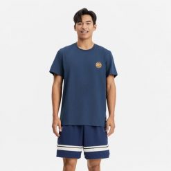 Koszulka koszykówki unisex Tarmak NBA Knicks TS 900. Niebieskie bluzki damskie TARMAK, xs, bez wzorów, z bawełny, sportowe, bez kołnierzyka, bez ramiączek. Za 79.99 zł.