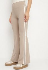 Beżowe Marszczone Legginsy Dzwony z Wysokim Stanem i Lampasami Nakatia. Brązowe legginsy damskie Born2be, bez wzorów, z jeansu. Za 49.99 zł.