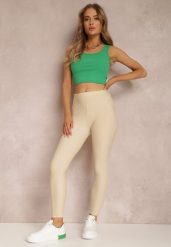 Jasnobeżowe Legginsy Hyraste. Brązowe legginsy damskie Renee, z aplikacjami, z dzianiny. Za 49.99 zł.