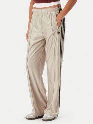 Adidas Spodnie dresowe Metallic Firebird KS9974 Beżowy Wide Leg. Brązowe spodnie sportowe damskie Adidas, bez wzorów, z dresówki. Za 369.99 zł.