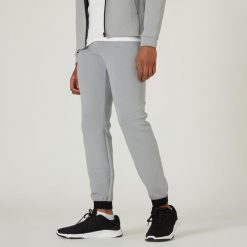 Spodnie dresowe męskie Nyamba Gym & Pilates 540 slim. Szare spodnie sportowe męskie DOMYOS, m, bez wzorów, z bawełny, na fitness i siłownię. W wyprzedaży za 89.99 zł.