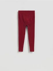 Bezszwowe legginsy - bordowy. Czerwone legginsy damskie Reserved, bez wzorów, z dzianiny. Za 89.99 zł.