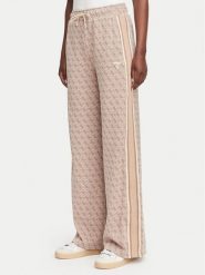 Guess Spodnie dresowe V6YB27 K5181 Beżowy Relaxed Fit. Brązowe spodnie dresowe damskie Guess, z aplikacjami, z dresówki. Za 474.99 zł.