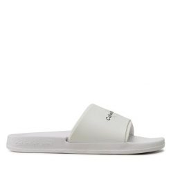 Klapki Calvin Klein Jeans. Białe klapki damskie Calvin Klein Jeans, bez wzorów, z jeansu, bez obcasa, bez zapięcia. Za 229.99 zł.