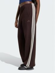 Adidas Spodnie dresowe 3-Stripes KW7703 Brązowy ciemny Wide Leg. Brązowe spodnie dresowe damskie Adidas, bez wzorów, z bawełny. Za 298.99 zł.