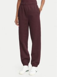 Lacoste Spodnie dresowe XF5244 Bordowy Regular Fit. Czerwone spodnie dresowe damskie Lacoste, bez wzorów, z bawełny. Za 624.99 zł.