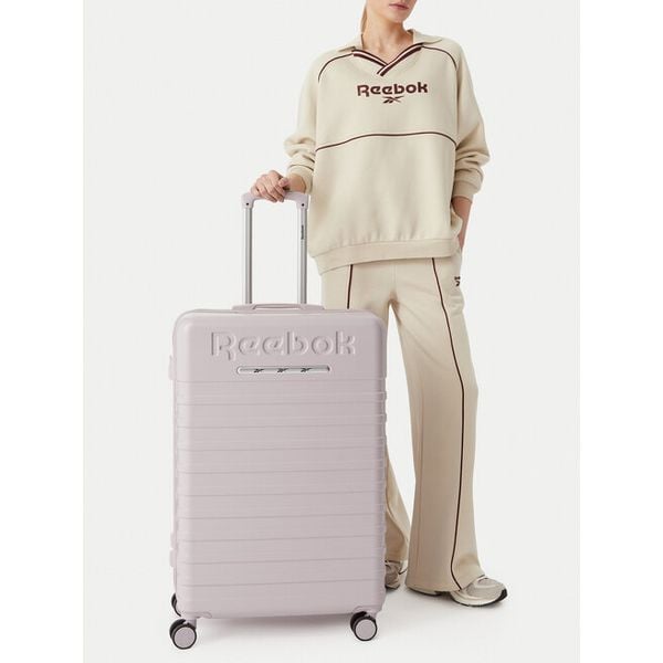 Walizka duża Reebok. Fioletowe walizki damskie Reebok, bez wzorów, duże. Za 349.99 zł.