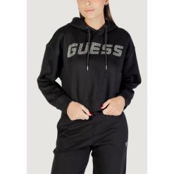 Bluza Kobieta GUESS ACTIVE PRIMULA RHINESTONES HOODIE SWE. Czarne bluzy damskie Guess Active, z aplikacjami, z bawełny, eleganckie, bez ramiączek, bez kaptura. W wyprzedaży za 331.80 zł.