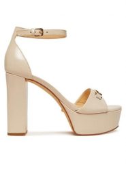 Guess Sandały FLJSET LEA03 Écru. Sandały damskie Guess, z aplikacjami, ze skóry, bez obcasa, na słupku, bez zapięcia. Za 529.99 zł.