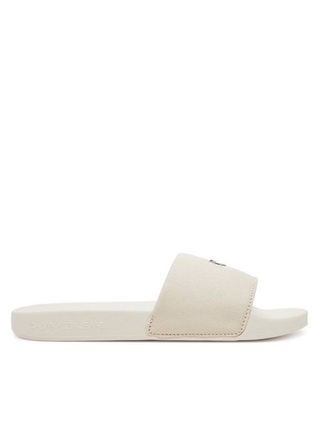 Calvin Klein Jeans Klapki Slide Monogram Hardware YW0YW01713 Écru. Klapki damskie Calvin Klein Jeans, bez wzorów, z jeansu, bez obcasa, bez zapięcia. Za 129.99 zł.