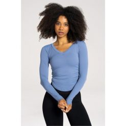 Koszulka fitness damska Gym Glamour wycięta z długimi rękawami. Niebieskie bluzki damskie GYM GLAMOUR, xs, bez wzorów, glamour, bez kołnierzyka, bez ramiączek. Za 149.99 zł.