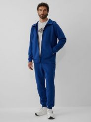 4F Spodnie dresowe joggery męskie - granatowe XL. Niebieskie spodnie materiałowe męskie 4F, bez wzorów, z dresówki. Za 189.99 zł.