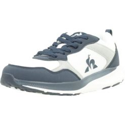 Buty LE COQ SPORTIF 2422716L Niebieski. Niebieskie obuwie trekkingowe damskie le coq sportif, z tkaniny, bez zapięcia. Za 209.40 zł.