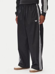 Adidas Spodnie dresowe Adicolor SST Cotton Twill KR1387 Czarny Relaxed Fit. Czarne spodnie sportowe męskie Adidas, m, bez wzorów, z dresówki. Za 314.99 zł.