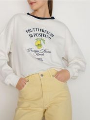 Bluza z nadrukiem - złamana biel. Bluzy damskie Reserved, l, bez wzorów, z bawełny, bez ramiączek, bez kaptura. W wyprzedaży za 99.99 zł.