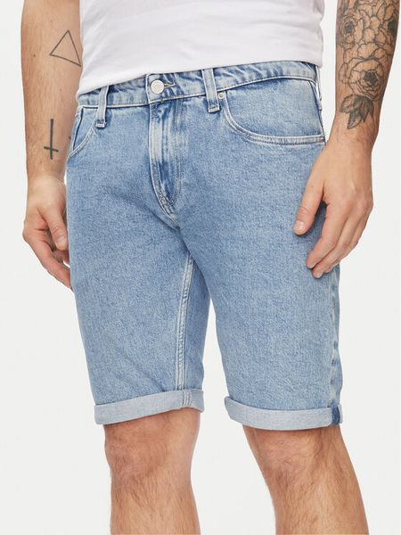 Tommy Jeans Szorty jeansowe Ronnie DM0DM19154 Niebieski Slim Fit. Niebieskie szorty męskie Tommy Jeans, bez wzorów, z bawełny. Za 329.99 zł.