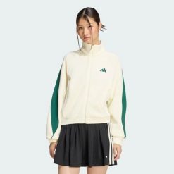 Bluza Stadium. Białe bluzy damskie Adidas, m, bez wzorów, z bawełny, sportowe, bez ramiączek, bez kaptura. Za 329.00 zł.