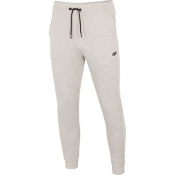 Spodnie dresowe męskie SPMD301 - chłodny jasny szary melanż. Szare spodnie sportowe męskie 4F, m, bez wzorów, z dresówki. Za 119.99 zł.