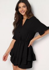 Czarny Taliowany Kombinezon z Gumką w Talii i Ozdobną Falbanką przy Rękawach Nanselena. Czarne sukienki damskie Born2be, na imprezę, bez wzorów, eleganckie, bez kołnierzyka, bez ramiączek, mini. Za 59.99 zł.