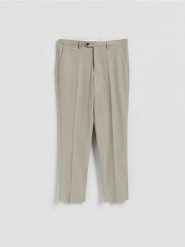 Spodnie garniturowe slim fit - oliwkowy. Zielone garnitury męskie Reserved, bez wzorów, z tkaniny. Za 169.99 zł.