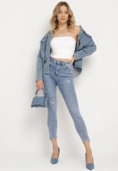 Jasnoniebieskie Bawełniane Jeansy Skinny z Przetarciami Erliaxa. Niebieskie jeansy damskie Born2be, bez wzorów, z bawełny, klasyczne. Za 89.99 zł.