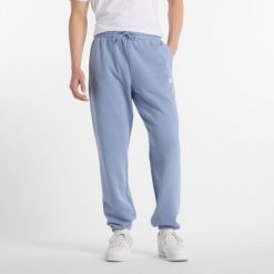 Spodnie męskie New Balance MP41519DUS – niebieskie. Niebieskie spodnie sportowe męskie New Balance, m, bez wzorów, z bawełny. Za 249.99 zł.