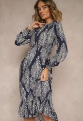 Niebieska Rozkloszowana Sukienka w Etniczny Print z Gumką w Talii i Falbanką Napirea. Niebieskie sukienki damskie Renee, na co dzień, m, bez wzorów, eleganckie, bez kołnierzyka, bez ramiączek, midi, rozkloszowane. Za 89.99 zł.