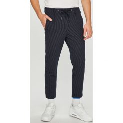 Jack & Jones - Spodnie. Niebieskie spodnie materiałowe męskie Jack & Jones, bez wzorów, z dzianiny, z podwyższonym stanem. W wyprzedaży za 89.90 zł.