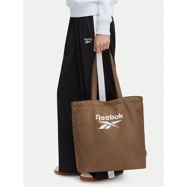 Torebka Reebok. Brązowe shopperki damskie Reebok, bez wzorów, bez dodatków. Za 69.99 zł.