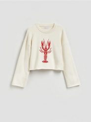 Sweter z haftem - kremowy. Białe swetry nierozpinane damskie Reserved, l, bez wzorów, z bawełny, bez kołnierzyka, bez ramiączek. Za 139.99 zł.