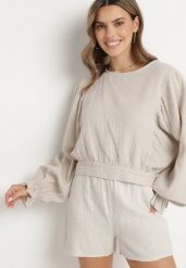 Beżowa Bluzka z Bawełny o Nietoperzowym Kroju z Wiązaniem Sepene. Brązowe bluzki damskie Born2be, z aplikacjami, z bawełny, eleganckie, bez kołnierzyka, bez ramiączek. Za 99.99 zł.