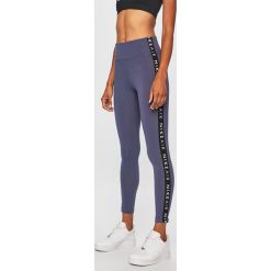 Nike Sportswear - Legginsy. Fioletowe legginsy damskie Nike Sportswear, bez wzorów, z bawełny. Za 139.90 zł.