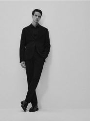Spodnie garniturowe slim fit - czarny. Czarne garnitury męskie Reserved, bez wzorów, z tkaniny. Za 159.99 zł.