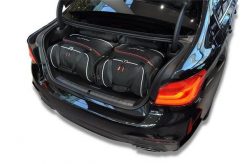 Torby Do Bagażnika Bmw 5 Limousine Phev 2020-2023 4Szt Kjust. Czarne torby podróżne damskie KJUST, bez wzorów, z kauczuku. Za 1,213.00 zł.