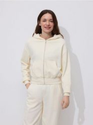 Rozpinana bluza - kremowy. Białe bluzy damskie Reserved, l, bez wzorów, z bawełny, bez ramiączek, bez kaptura. Za 109.99 zł.