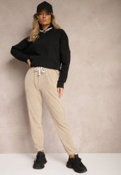 Ciemnobeżowe Dresowe Spodnie z Bawełną High Waist Wykończone w Pasie Gumką Ekadela. Brązowe spodnie dresowe damskie Renee, bez wzorów, z bawełny, z podwyższonym stanem. Za 49.99 zł.