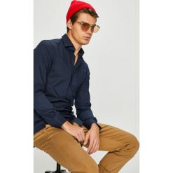 Tommy Hilfiger Tailored - Koszula. Białe koszule męskie Tommy Hilfiger Tailored, m, bez wzorów, z bawełny, casualowe, bez kołnierzyka, bez ramiączek. W wyprzedaży za 339.90 zł.