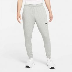 Spodnie sportowe męskie Nike Drifit Trapered. Czarne buty sportowe męskie Nike, m, bez wzorów, z dresówki, na fitness i siłownię. Za 358.00 zł.