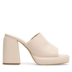 Klapki JENNY. Brązowe klapki damskie Jenny, bez wzorów, bez obcasa, bez zapięcia. Za 139.99 zł.