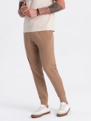 Spodnie męskie dresowe typu jogger - brązowe V2. Brązowe spodnie sportowe męskie Ombre Clothing, m, bez wzorów, z bawełny. W wyprzedaży za 101.24 zł.