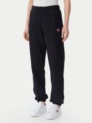 Tommy Jeans Spodnie dresowe Badge DW0DW20679 Czarny Regular Fit. Czarne spodnie dresowe damskie Tommy Jeans, bez wzorów, z bawełny. Za 219.99 zł.