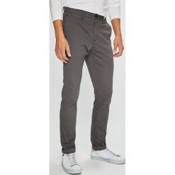 Tommy Hilfiger - Spodnie. Szare eleganckie spodnie męskie Tommy Hilfiger, bez wzorów, z tkaniny, casualowe. W wyprzedaży za 459.90 zł.
